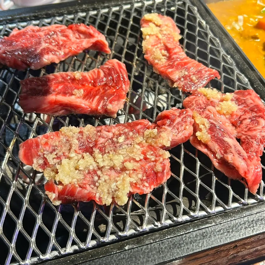 Hwangje neukgansal placed on the charcoal grill