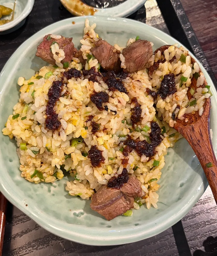 Mixed steak pot rice moved onto a plate
