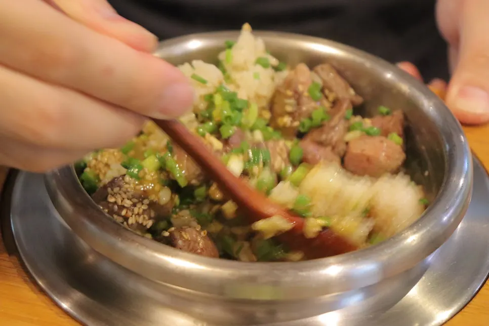 Steak pot rice mixed together with the rice