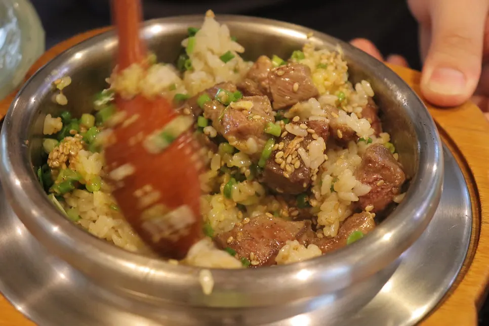 Table mid-meal with the steak pot rice