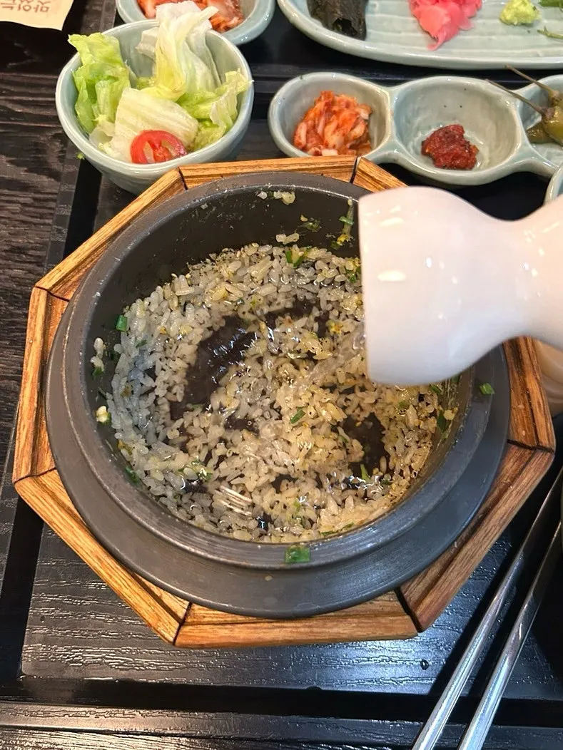 Steak pot rice topped with egg yolk