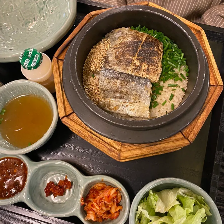 Close-up of pot rice piled high with steak