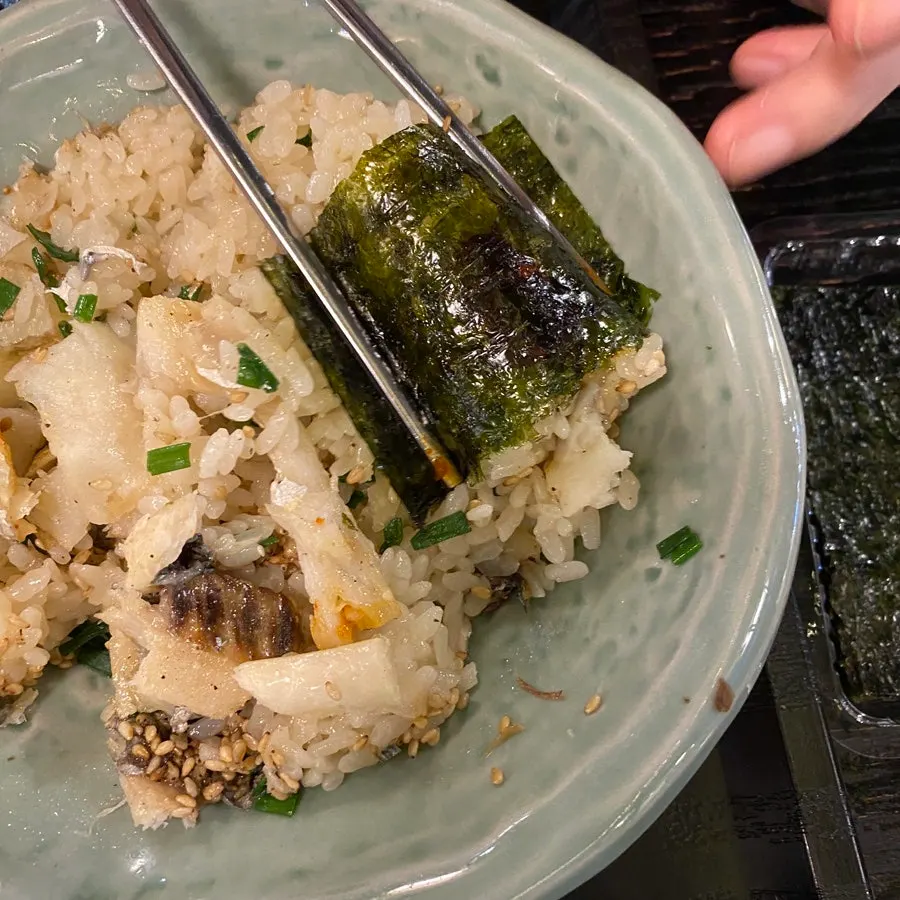 Hairtail pot rice mixed together in a bowl