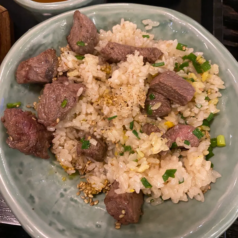 A bite of pot rice wrapped in seaweed
