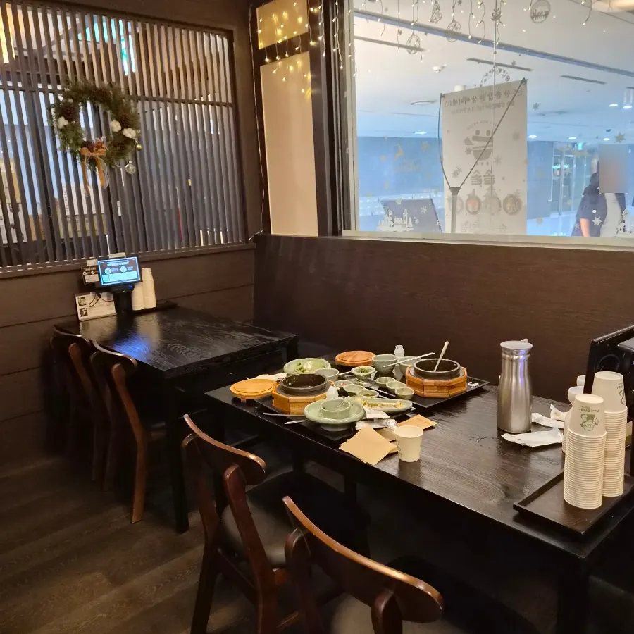 Wood-tone interior seating at Solsot Sangam Branch