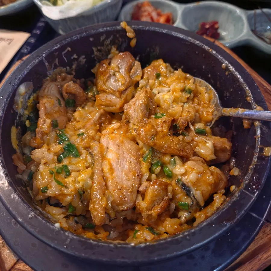 Cheese dakgalbi pot rice topped with egg yolk