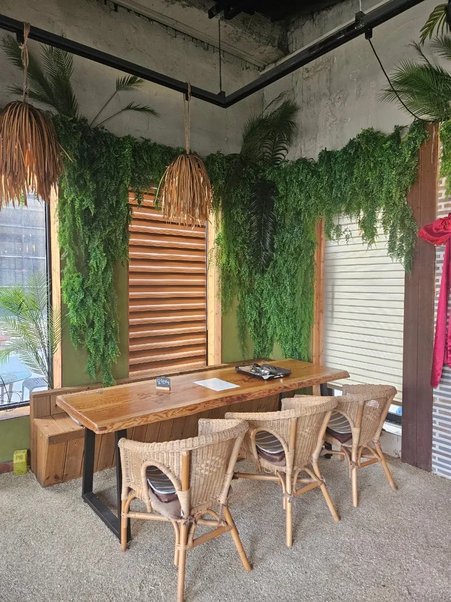 Indoor seating decorated with plants and lighting