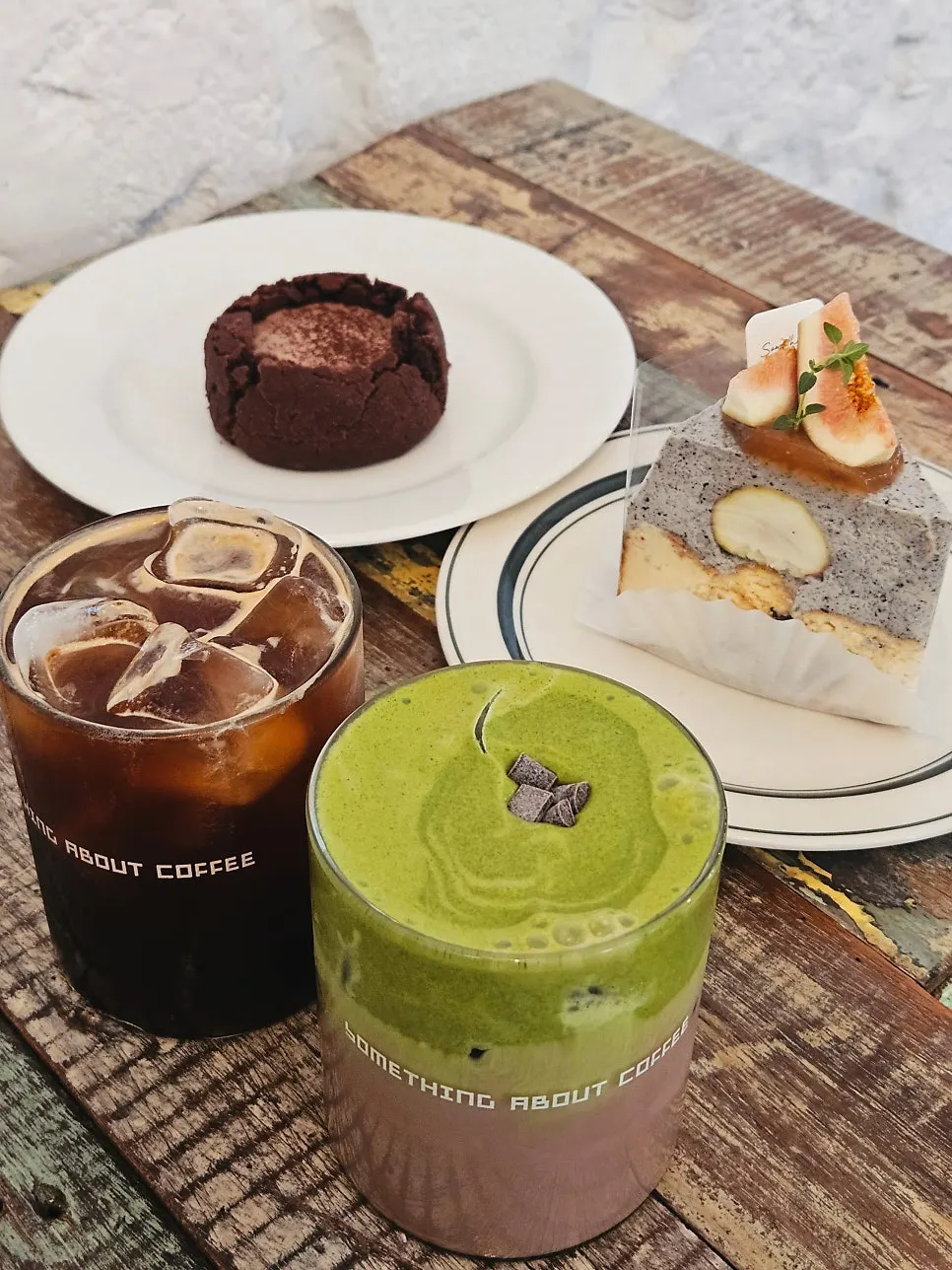Matcha choco latte topped with matcha cream at Something About Coffee