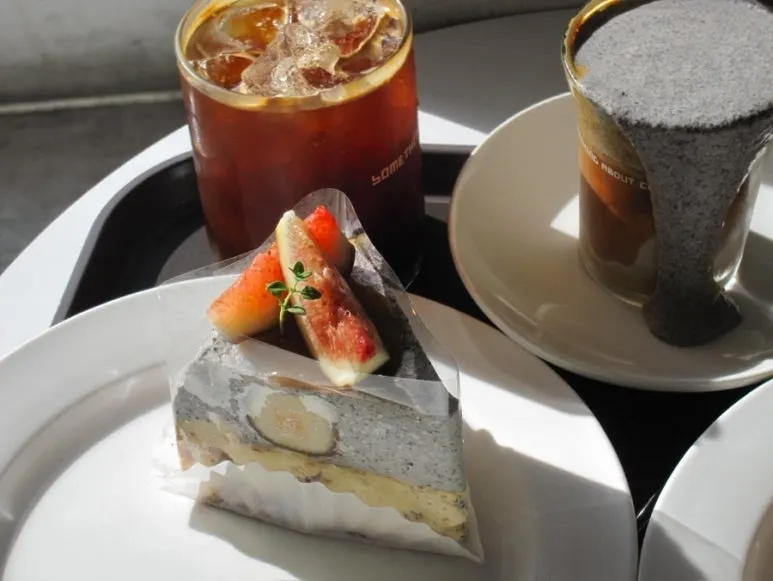 Two slices of cake and drinks on the table