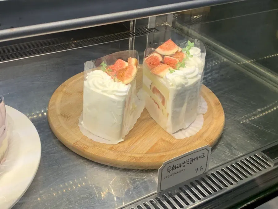 Cakes lined up in the display case