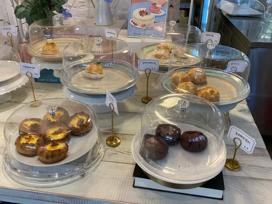 Display shelf lined with scones and financiers