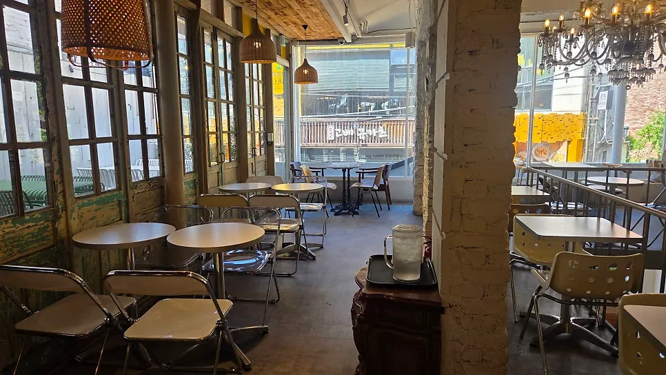 Exterior of Something About Coffee in the alley by CGV