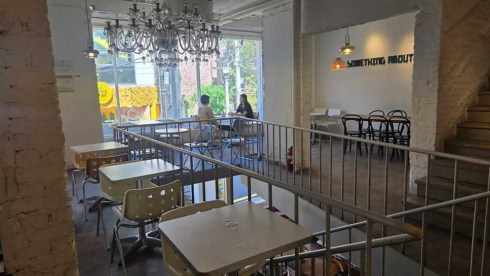 2nd-floor seating with the order counter at Something About Coffee
