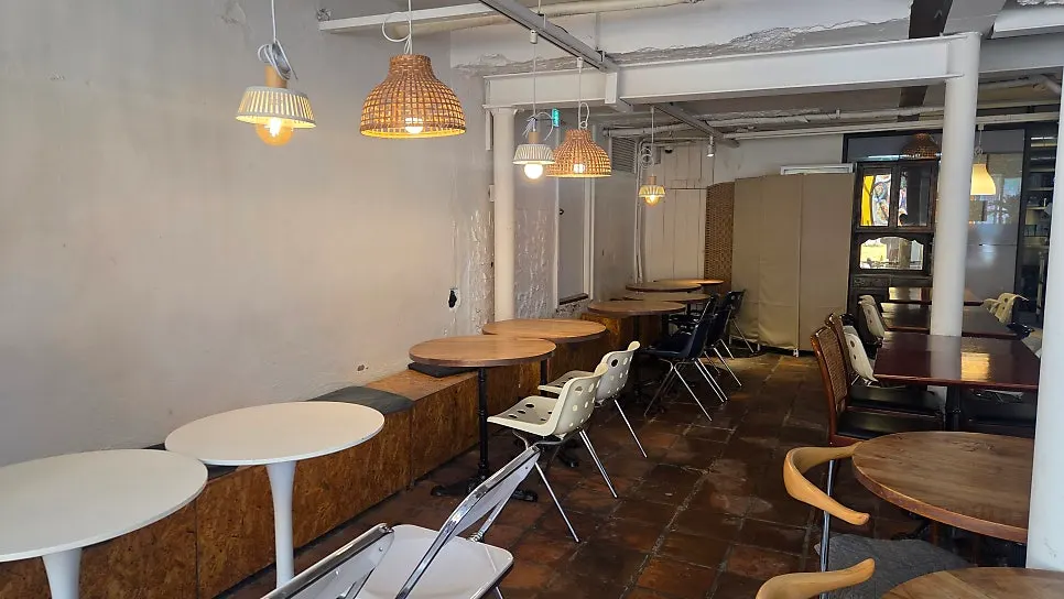 1st-floor window seat overlooking the alley through the floor-to-ceiling glass
