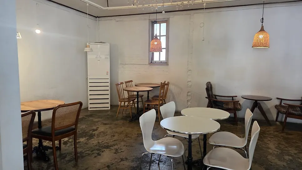 1st-floor seating near the kitchen at Something About Coffee