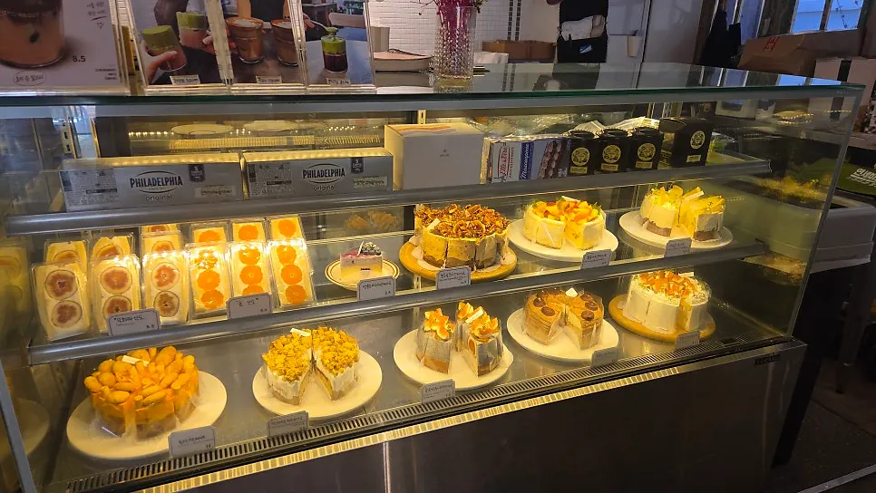 Dessert showcase with cakes and baked snacks