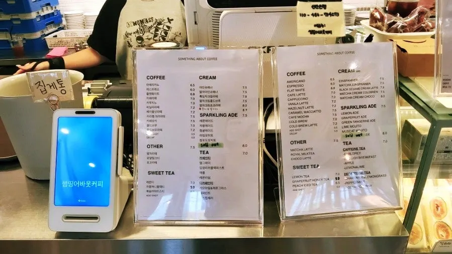 Drink menu board at Something About Coffee
