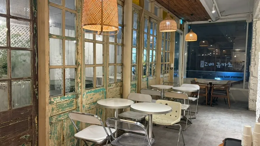 Separated two-top and four-top café seating