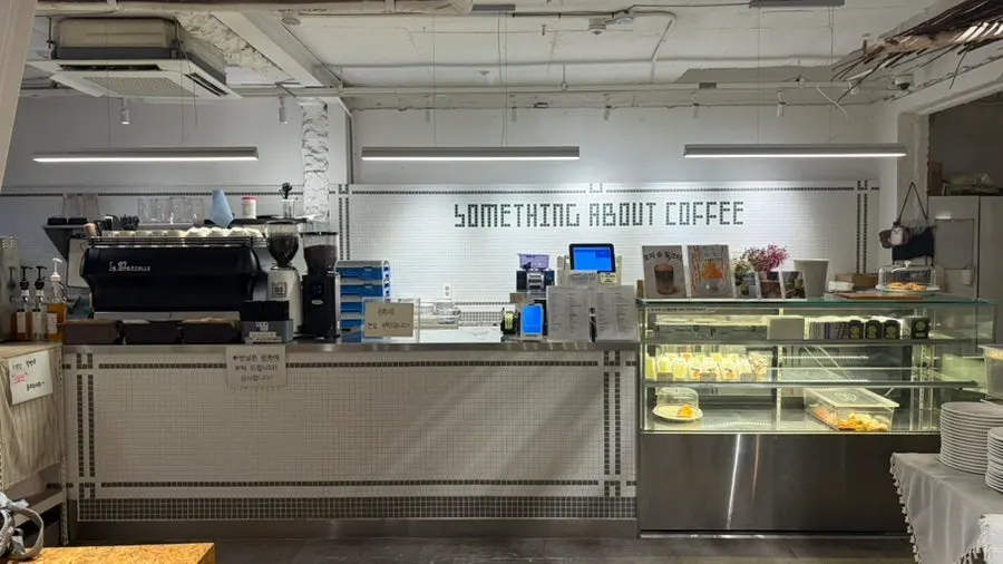 Something About Coffee's drink menu board