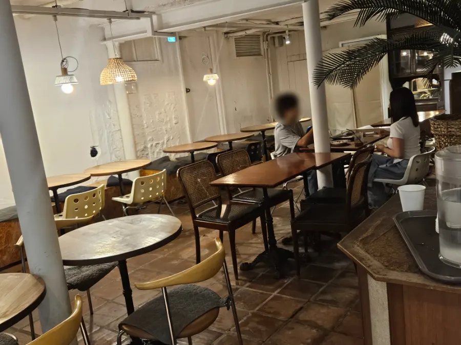 Interior and seating on the first floor of Something About Coffee