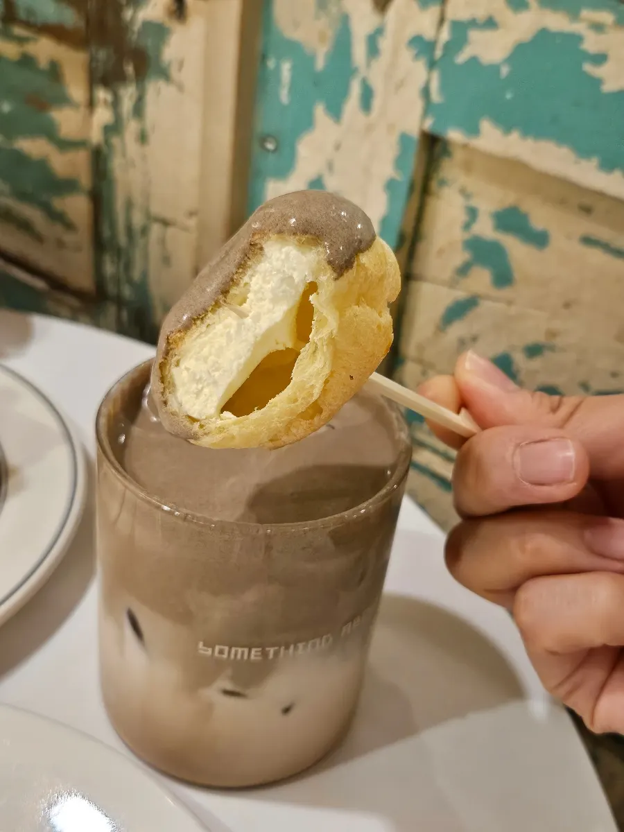 Hojicha choux milk tea topped with hojicha cream and cream choux