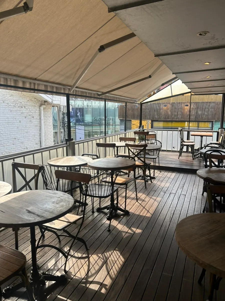 Outdoor seating and window seats at the café