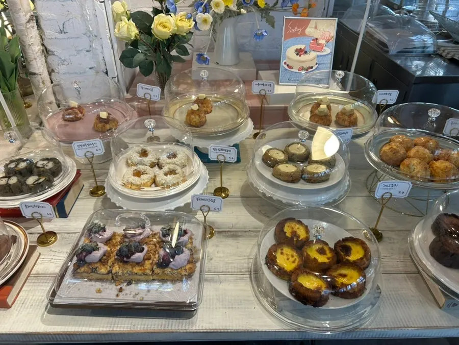 Display case with pound cakes and financiers