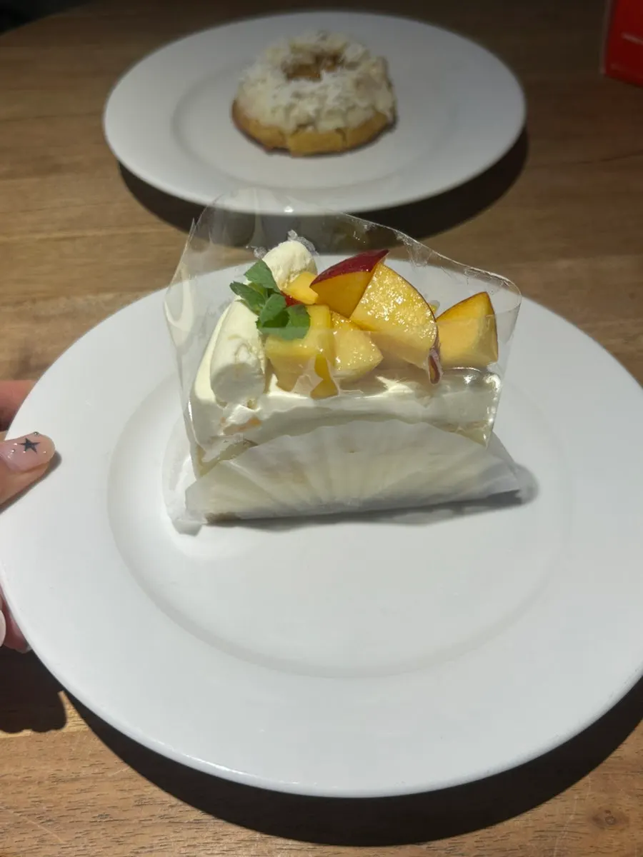Peach cheesecake plated on a dish