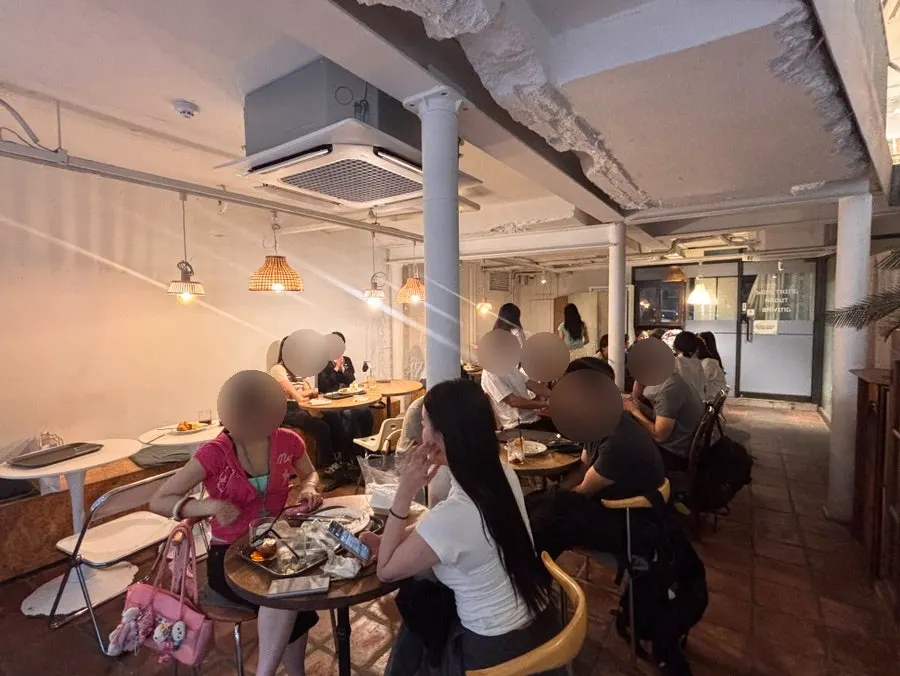 Warm-toned interior of the café's first floor
