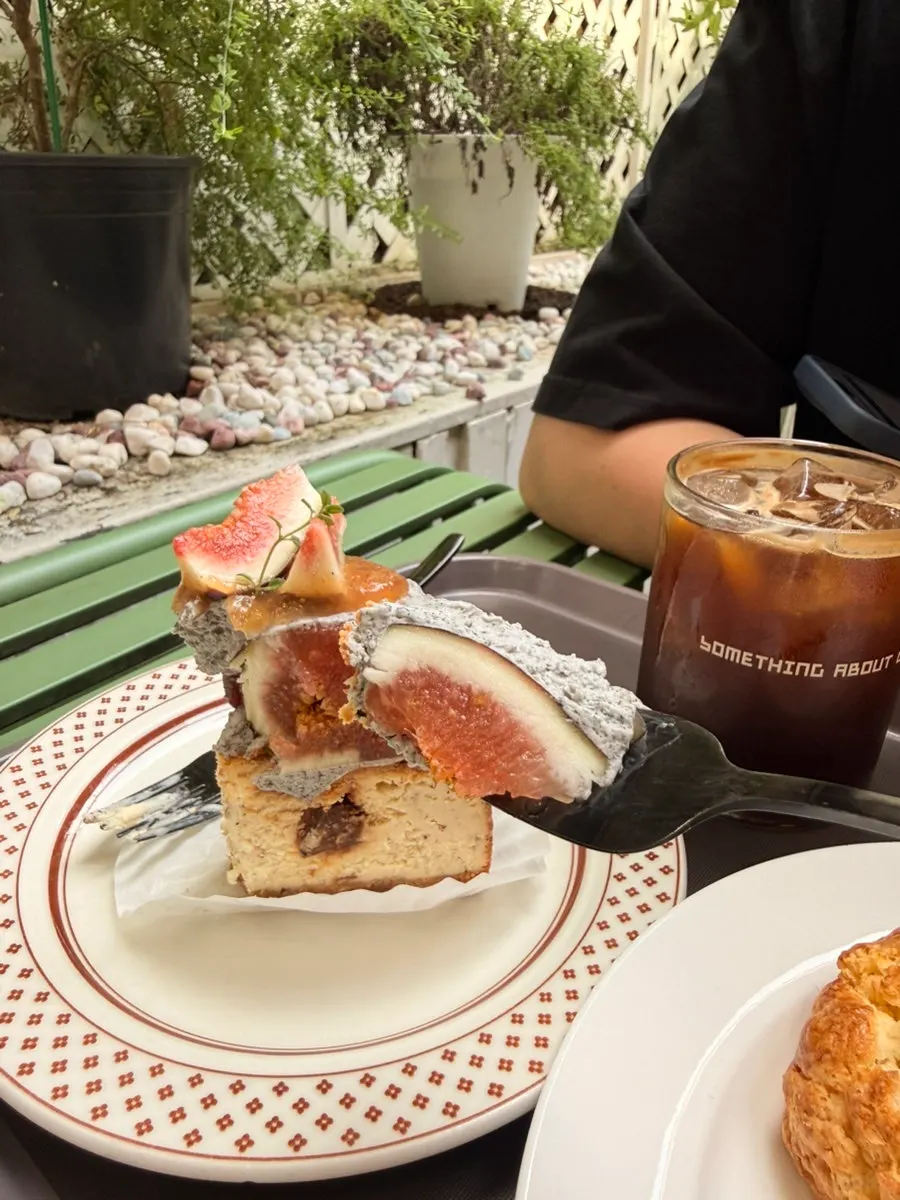 A slice of black sesame fig cheesecake
