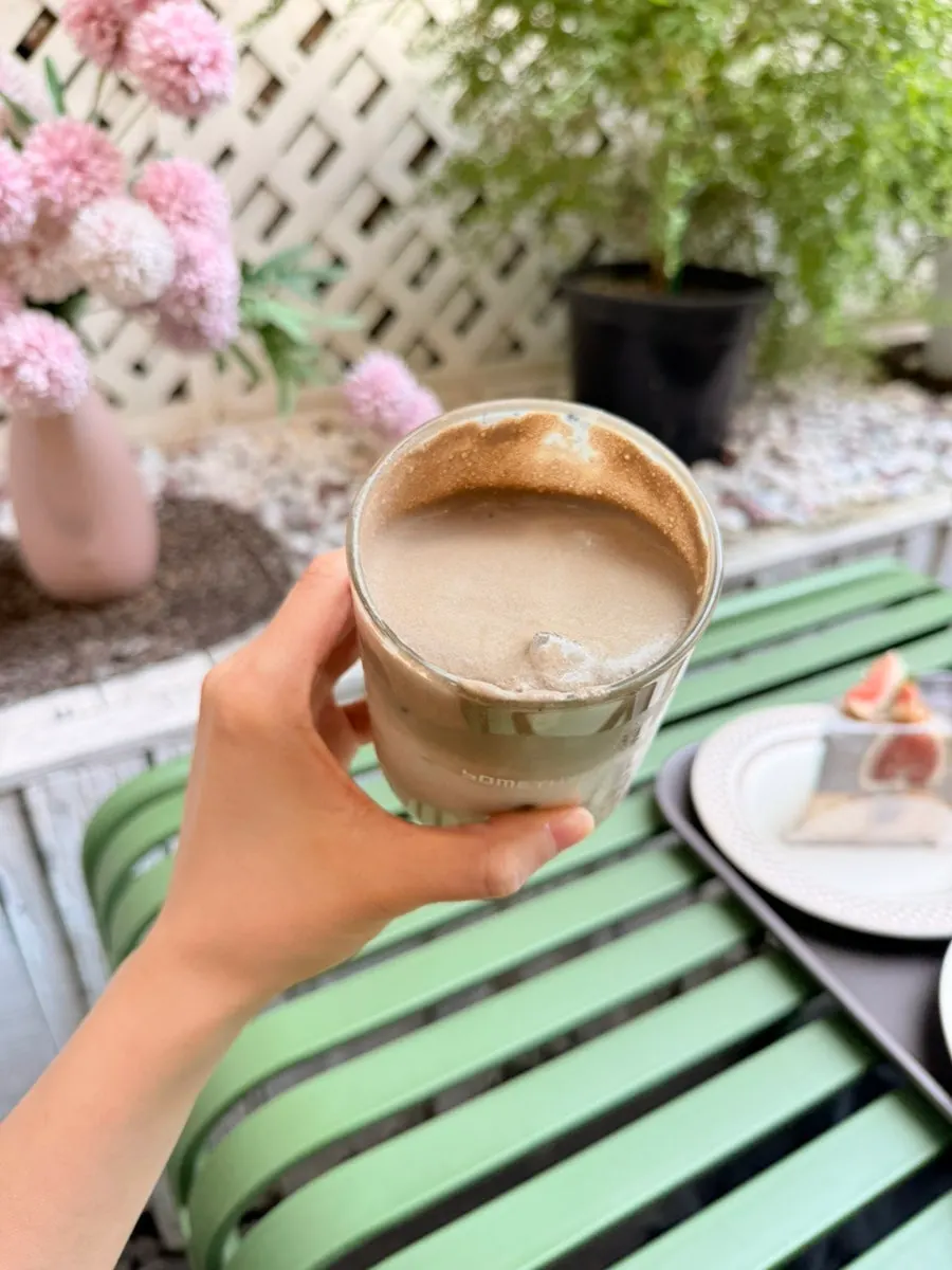 Milk tea layer beneath the hojicha foam
