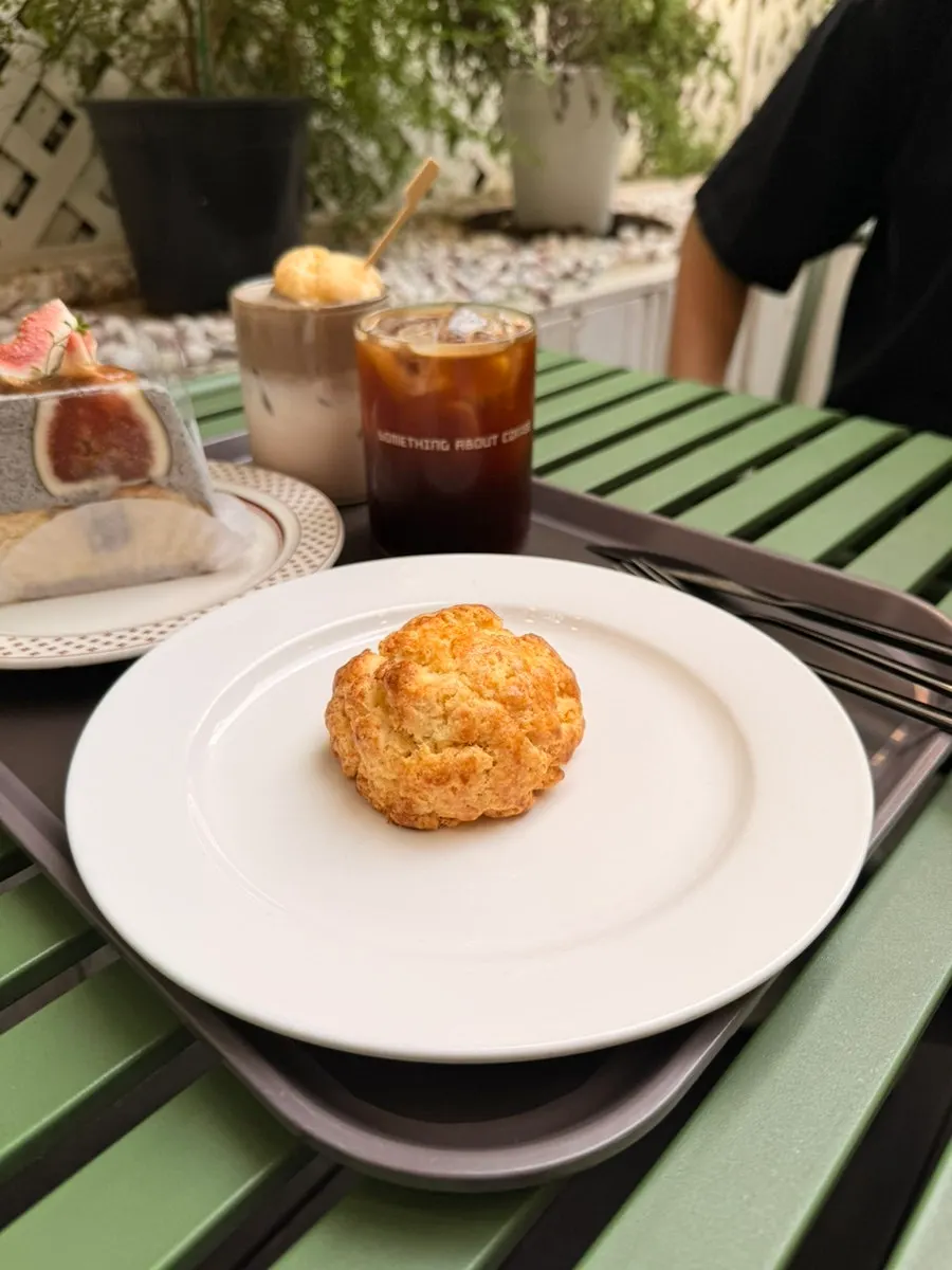 Plain scone and drink set on the terrace table