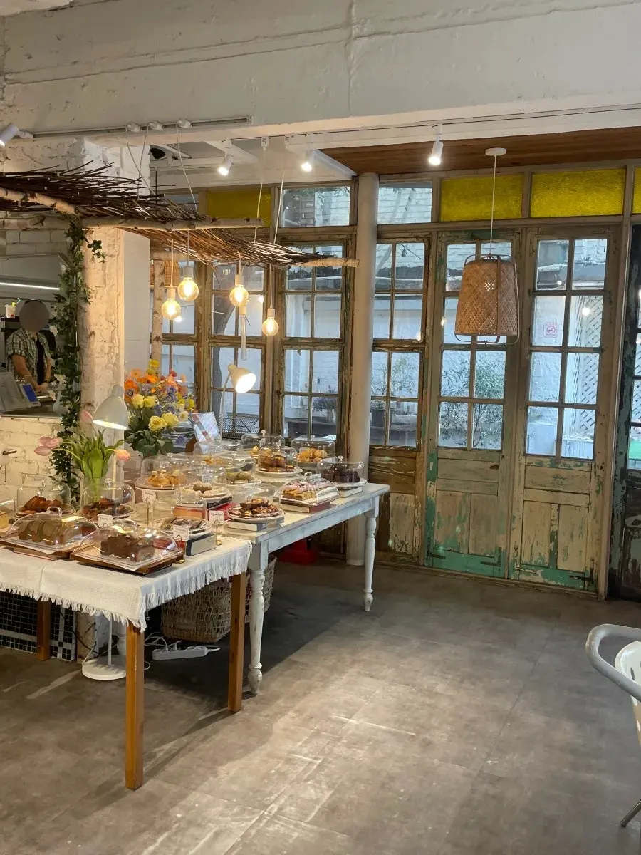 Window-side table and large group table in the white interior