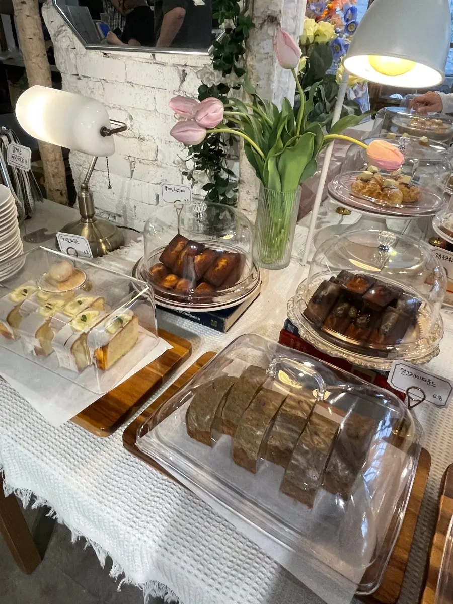 Baked goods display with pound cakes and financiers