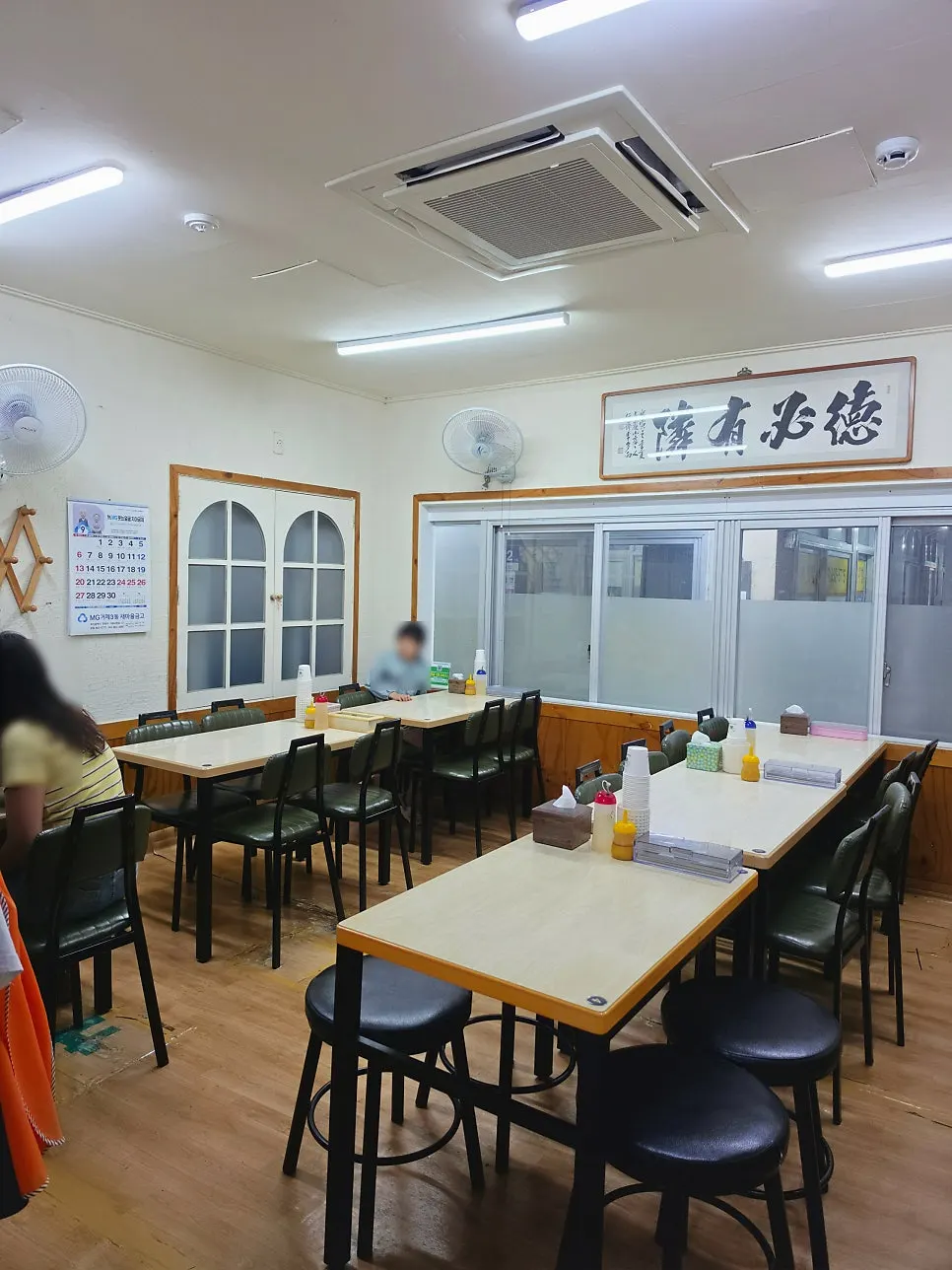View of the seating area with four-person tables