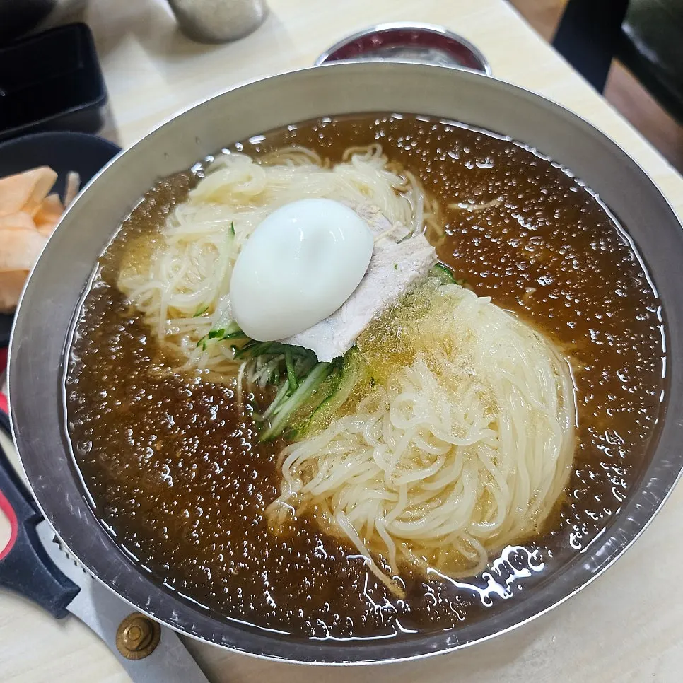 A bowl of double portion milmyeon topped with slushy ice