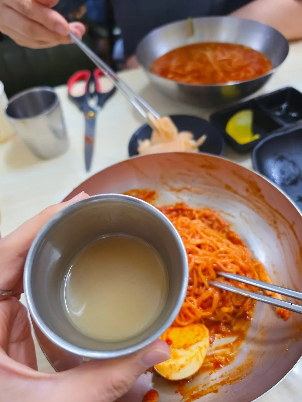 Warm meat broth poured into a cup