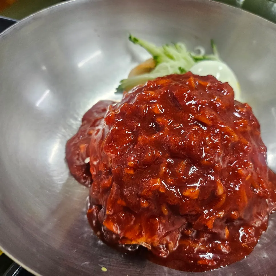 Bibim milmyeon coated in red sauce