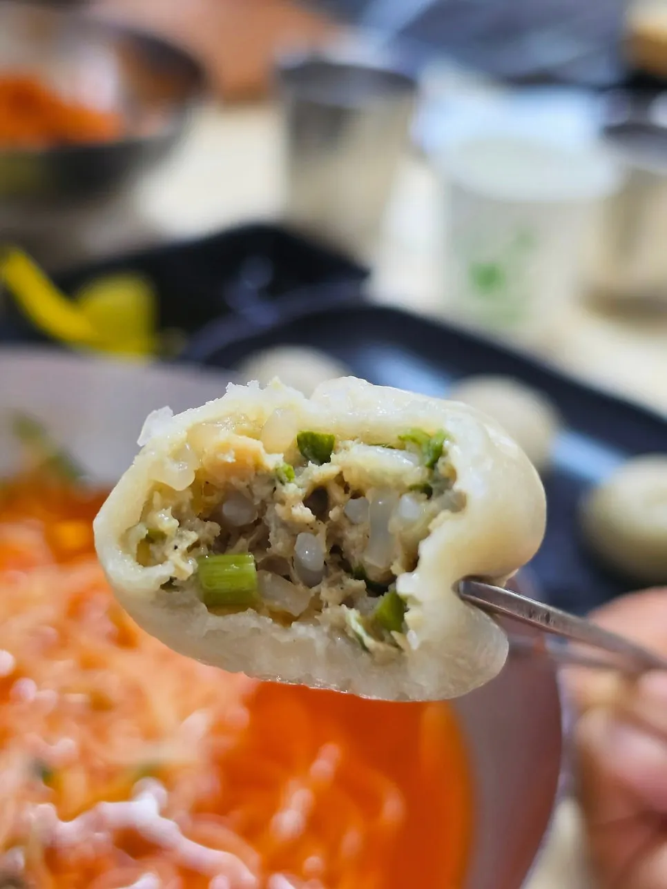 Inside of a dumpling filled with meat and glass noodles