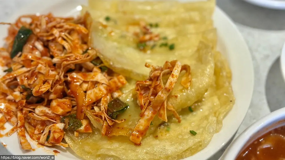 Seasoned vegetables placed on a flat dumpling skin