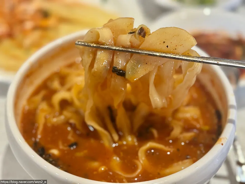 Jang-kalguksu with visible potato and zucchini