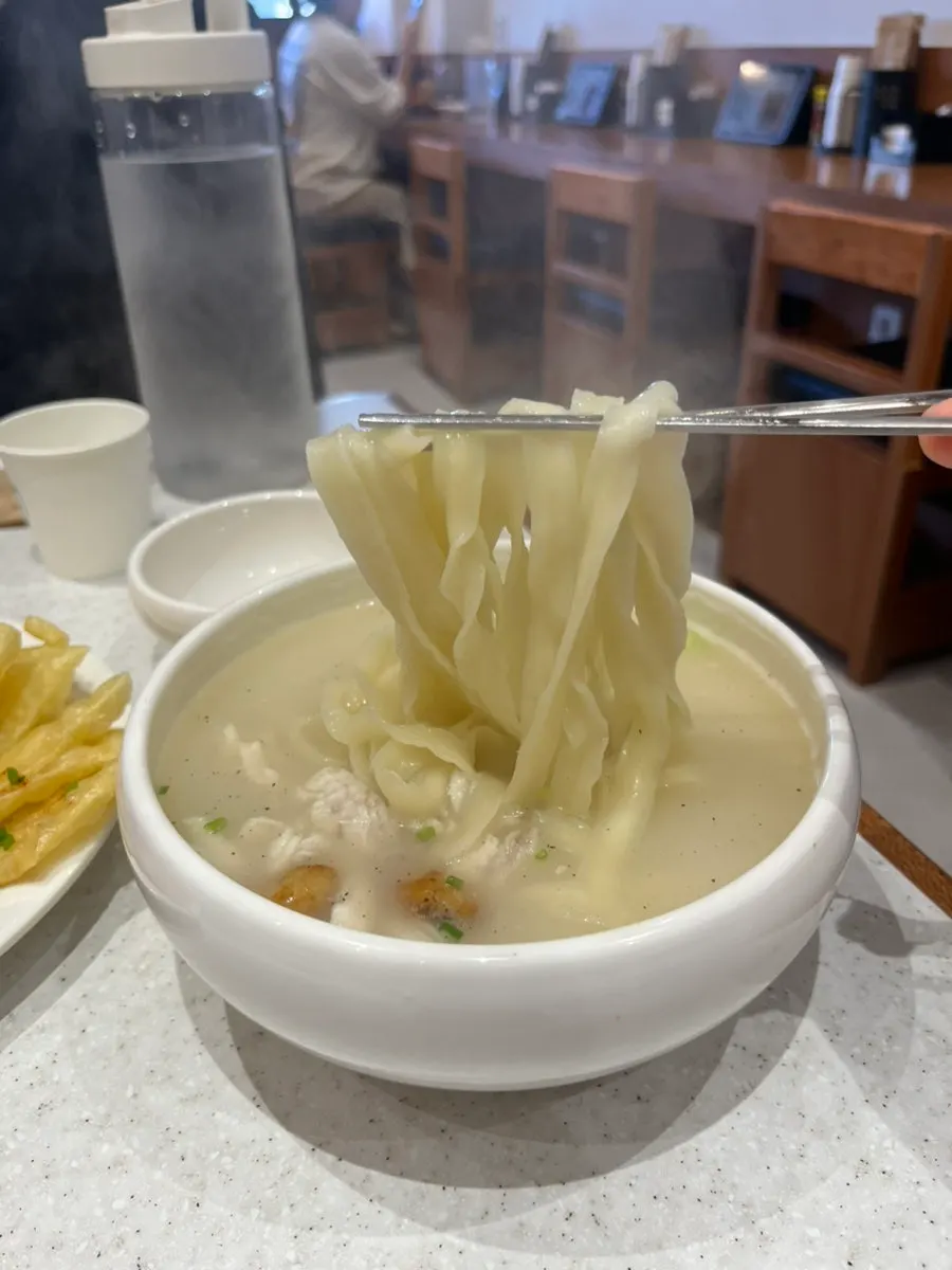 A bowl full of hot kalguksu broth