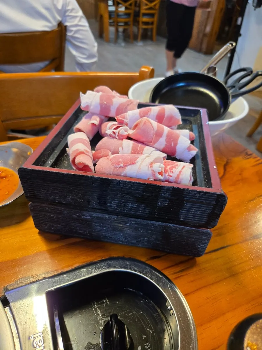 Beef lightly cooked in the broth