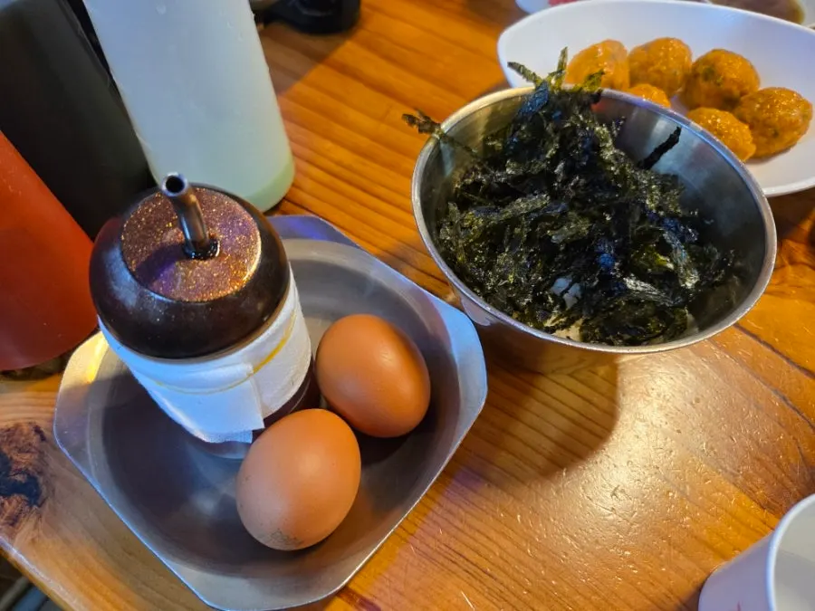 Self-serve egg porridge made with the leftover broth