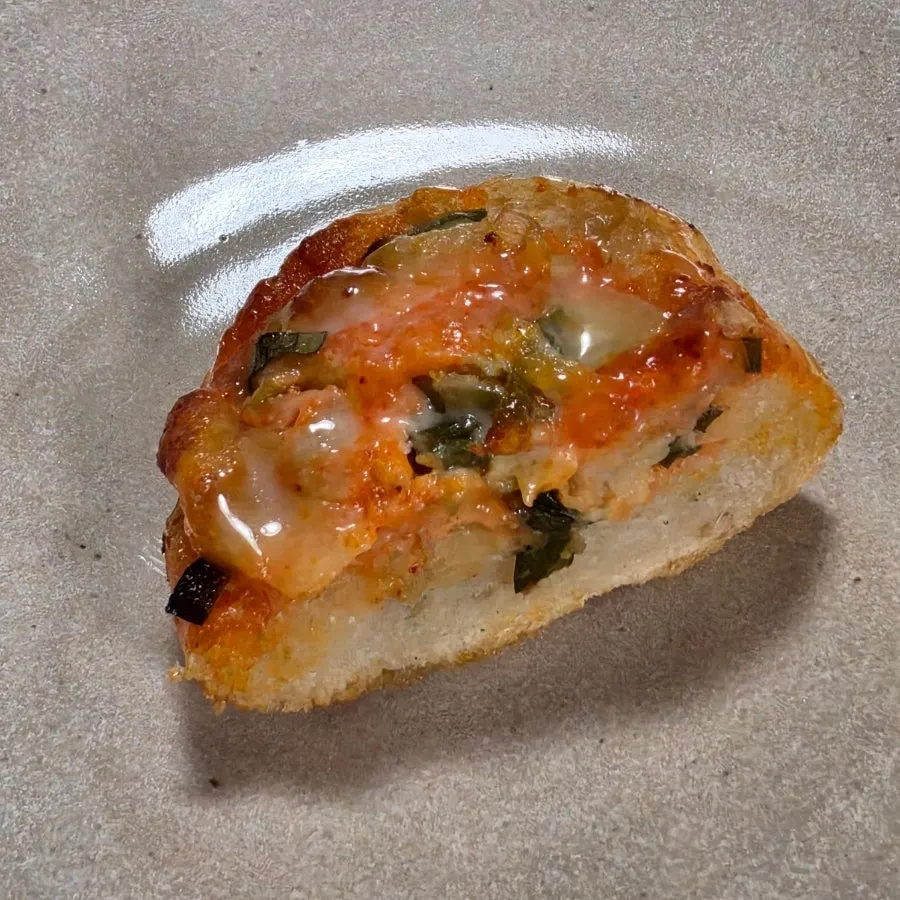 Myeongran daepa baguette showing olives and scallions