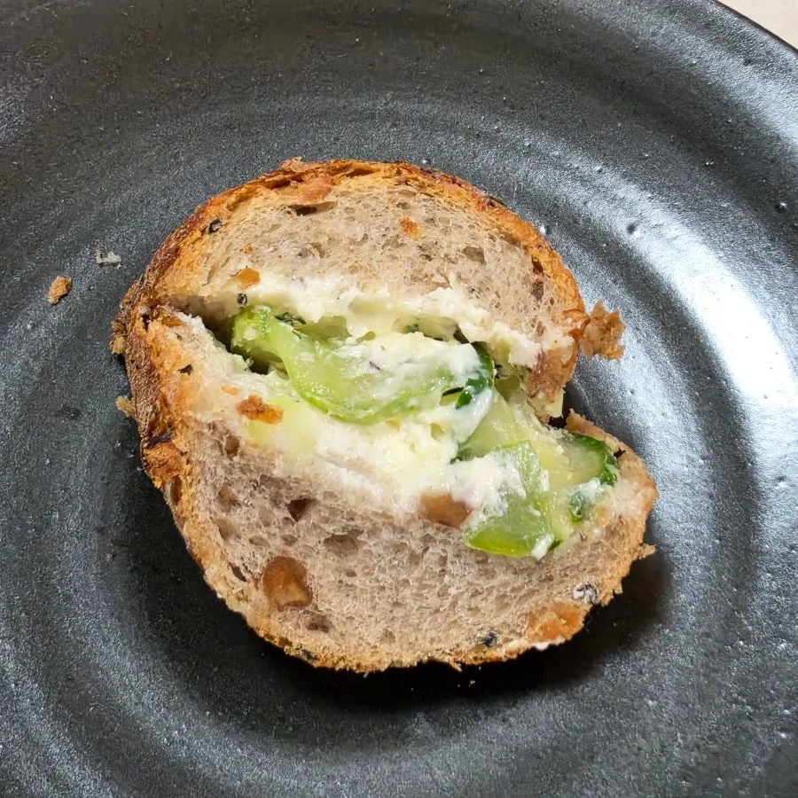 Close-up of cucumber and dill on the baguette