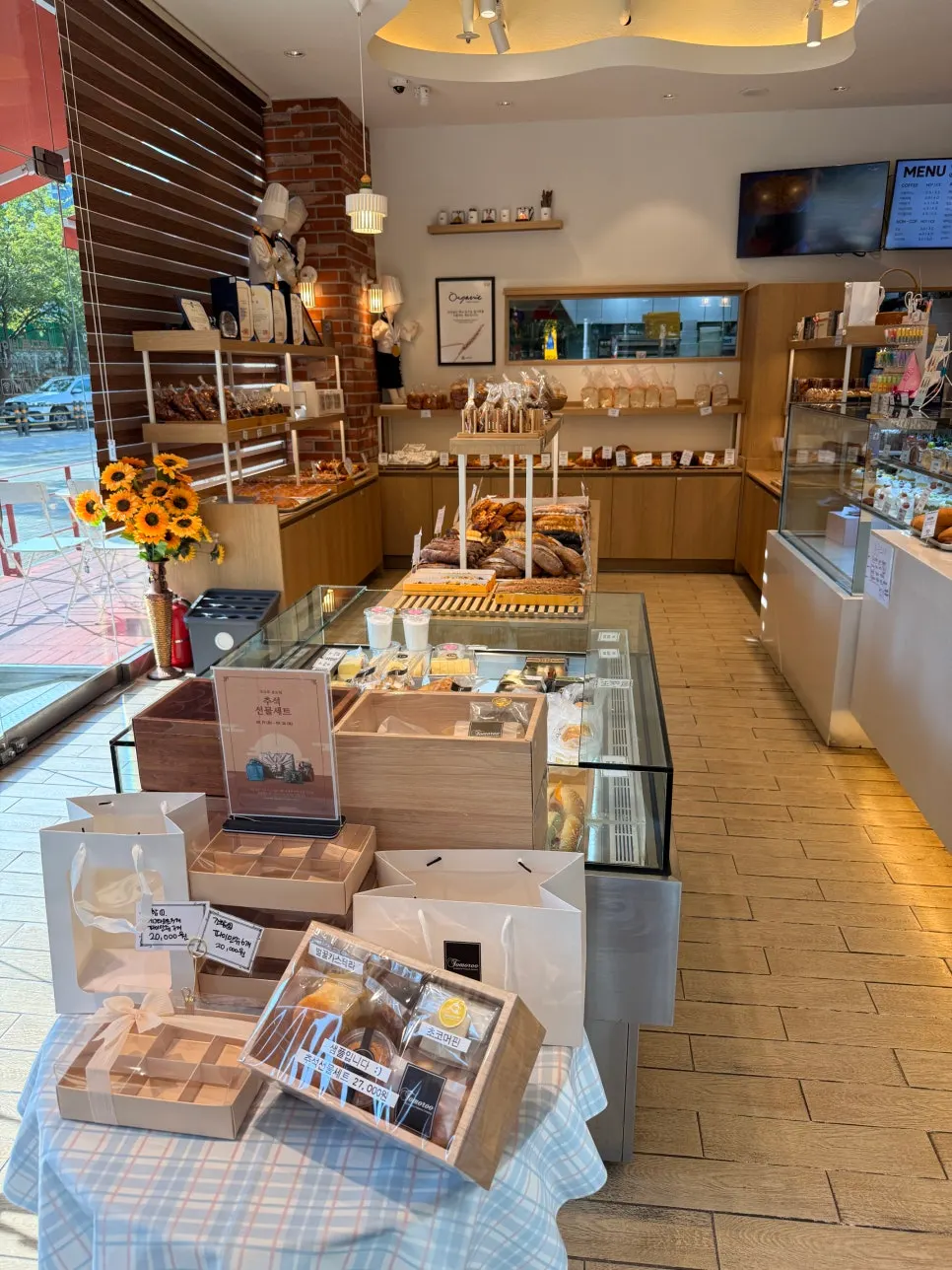 Bakery display case topped with freshly baked bread