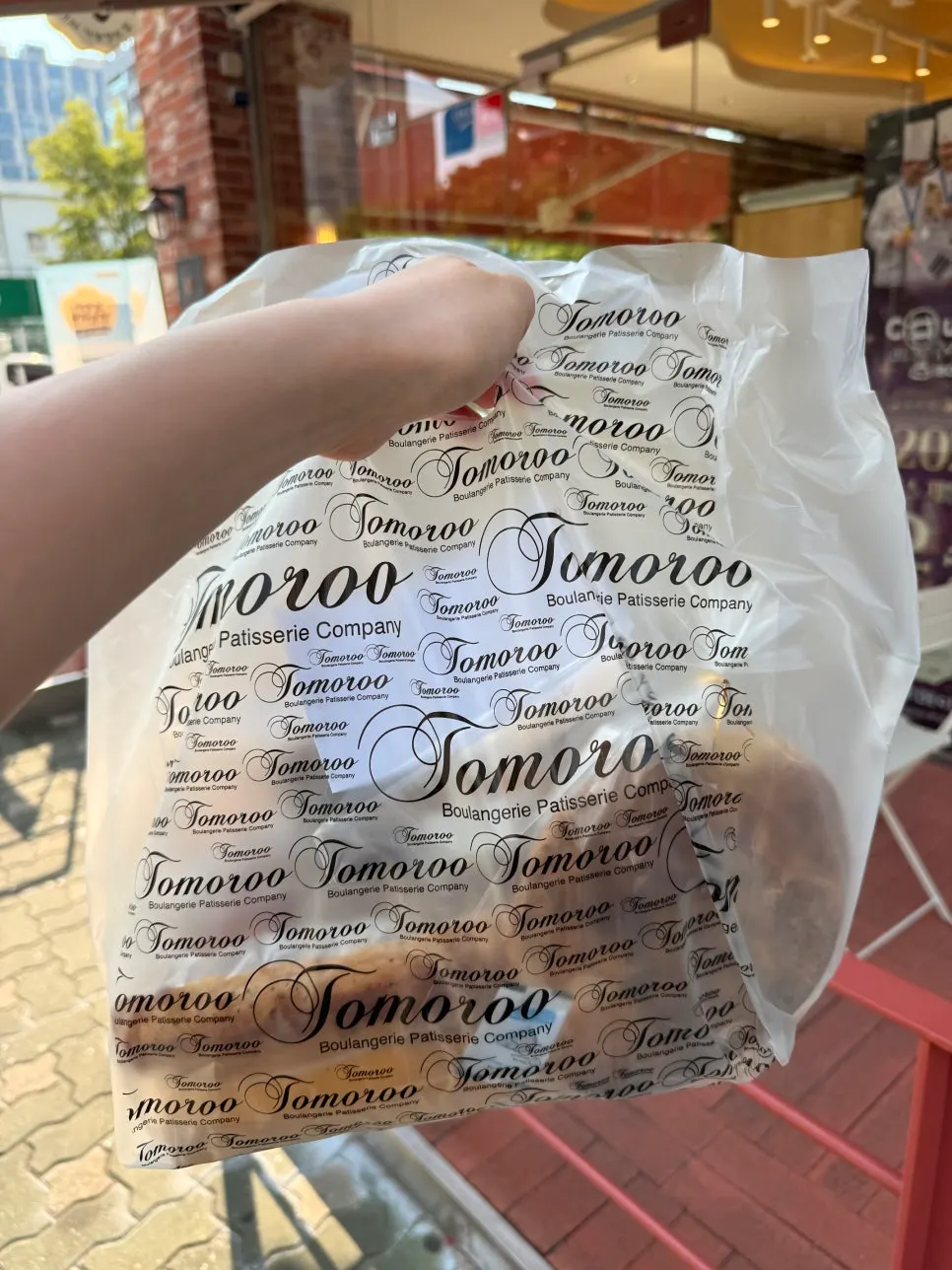 A bag packed full of bread purchases