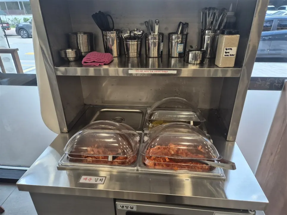 Self-serve bar with danmuji, kimchi, and spicy kimchi