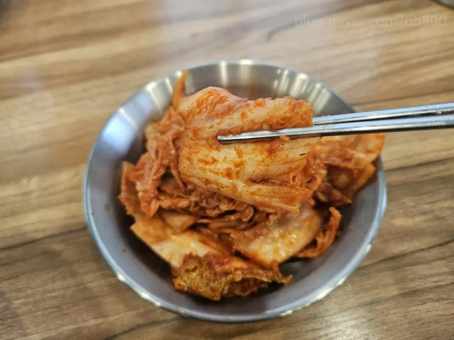 Kimchi alongside the chicken broth